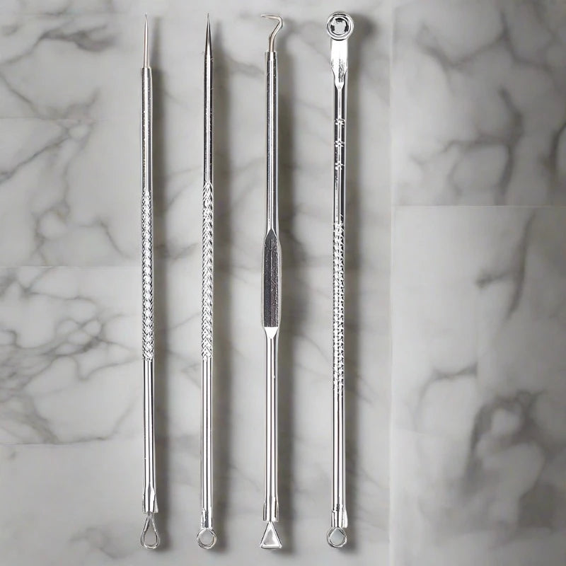 Set of four stainless steel acne removal tools, designed to safely and effectively extract blackheads and comedones from the skin.
